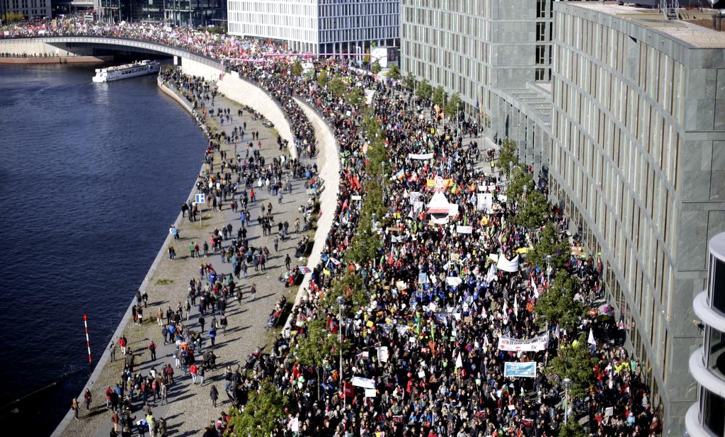 Tens of thousands of protestors attend a demonstration against the free trade agreements TTIP (Transatlantic Trade and Investment Partnership) and CETA (Comprehensive Economic and Trade Agreement) in Berlin, Germany, Saturday, Oct. 10, 2015. (AP Photo/Markus Schreiber)