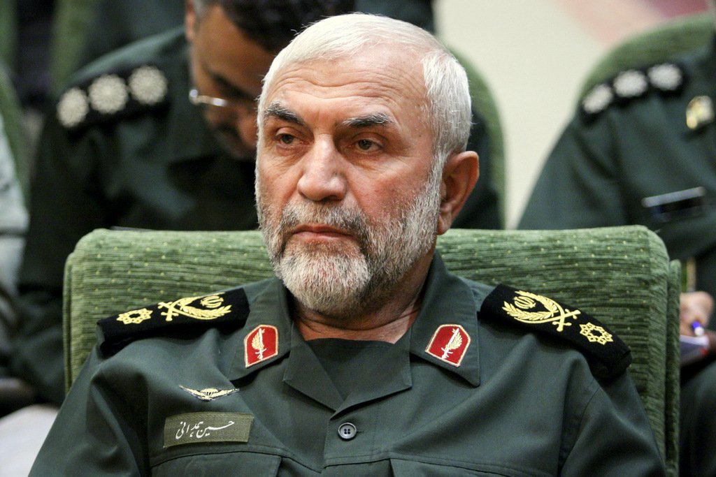 In this Dec. 9, 2009 photo, released by Iranian Tasnim News Agency, Iranian Revolutionary Guard Gen. Hossein Hamedani sits in a meeting in Tehran, Iran. Hamedani, a senior commander in Iran's powerful Revolutionary Guard was killed by Islamic State extremists on the outskirts of the northern Syrian city of Aleppo, Iranian state media reported on Friday. A state television report said that Gen. Hossein Hamedani was killed in the suburbs of Aleppo while "carrying out an advisory mission." (AP Photo/Tasnim News Agency, Hamed Malekpour)