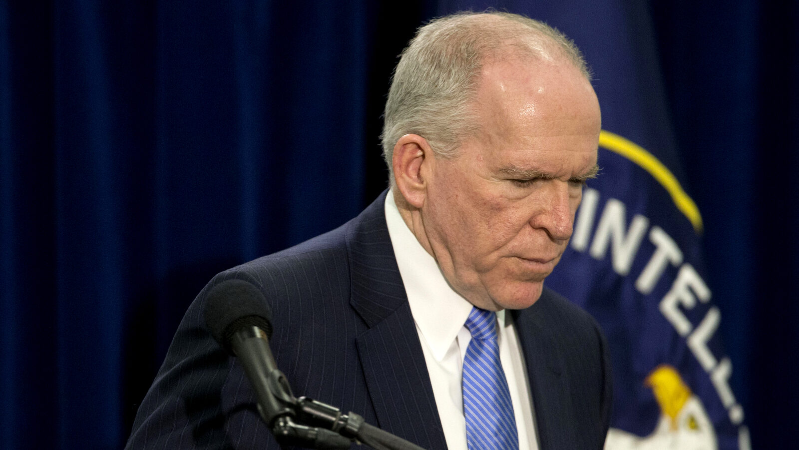 CIA Director John Brennan leaves after his news conference at CIA headquarters in Langley, Va., Thursday, Dec. 11, 2014. (AP Photo/Pablo Martinez Monsivais)