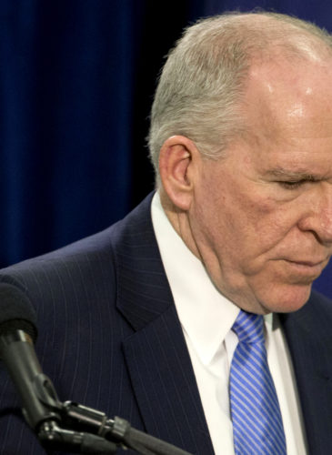 CIA Director John Brennan leaves after his news conference at CIA headquarters in Langley, Va., Thursday, Dec. 11, 2014. (AP Photo/Pablo Martinez Monsivais)
