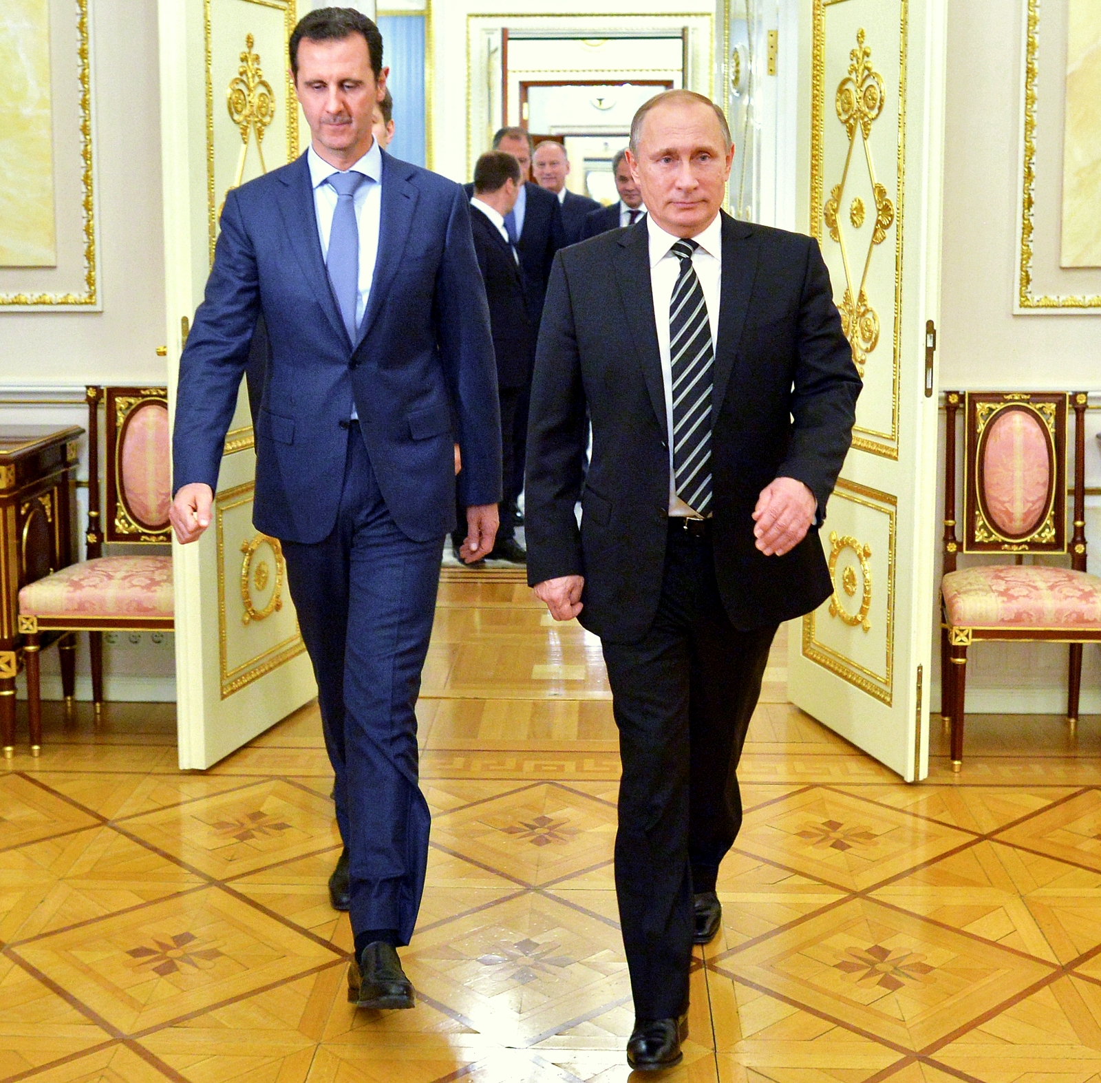 In this photo taken on Tuesday, Oct. 20, 2015, Russian President Vladimir Putin, right, and Syria President Bashar Assad arrive for their meeting in the Kremlin in Moscow, Russia. President Bashar Assad was in Moscow, in his first known trip abroad since the war broke out in Syria in 2011, to meet his strongest ally Russian leader Vladimir Putin. The two leaders stressed that the military operations in Syria_ in which Moscow is the latest and most powerful addition_ must lead to a political process. (Alexei Druzhinin, RIA-Novosti, Kremlin Pool Photo via AP)