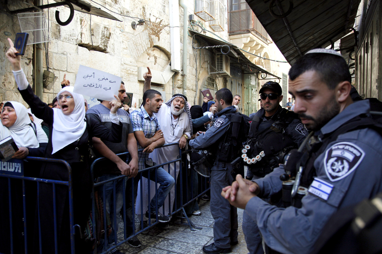 Israeli police corral Palestinians attempting to enter Islam's third holiest spot known to Muslims as the Noble Sanctuary in the Old City of Jerusalem on Thursday, Sept. 17, 2015. (AP Photo/Mahmoud Illean)