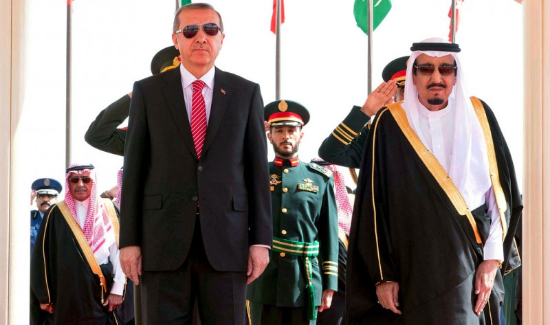 In this photo provided by the Saudi Press Agency, Turkey's President Recep Tayyip Erdogan, left, stands with Saudi King Salman during an arrival ceremony, in Riyadh, Saudi Arabia, Monday, March 2, 2015. (AP Photo/SPA)