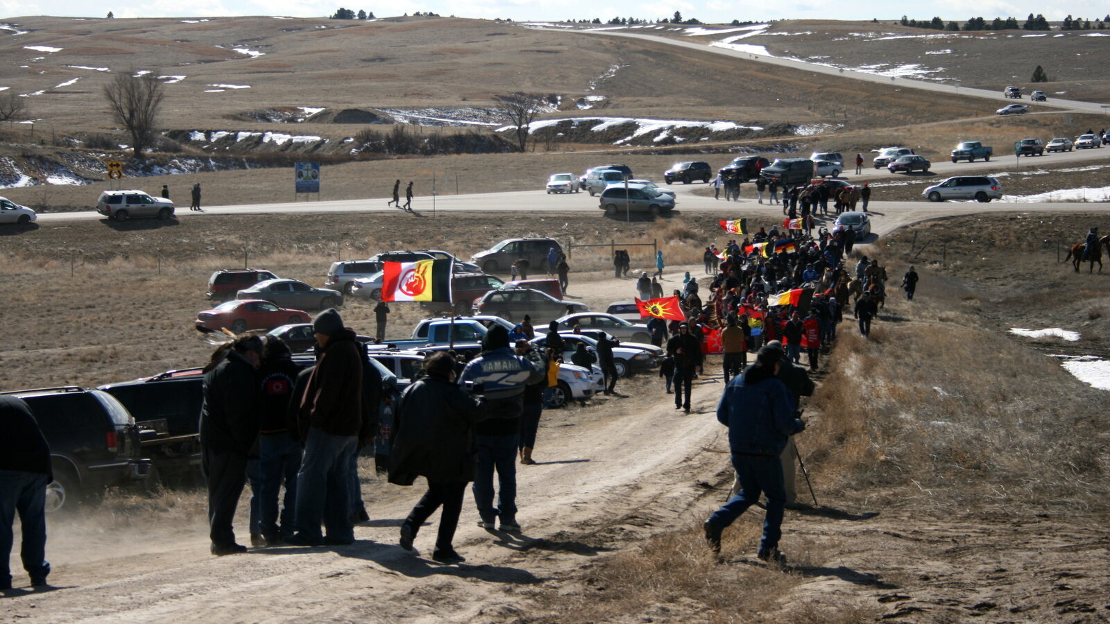 Members of the American Indian Movement walk to the Wounded Knee Massacre Monument Wednesday, Feb. 27, 2013 in Wounded Knee, S.D. (AP Photo/Kristi Eaton)