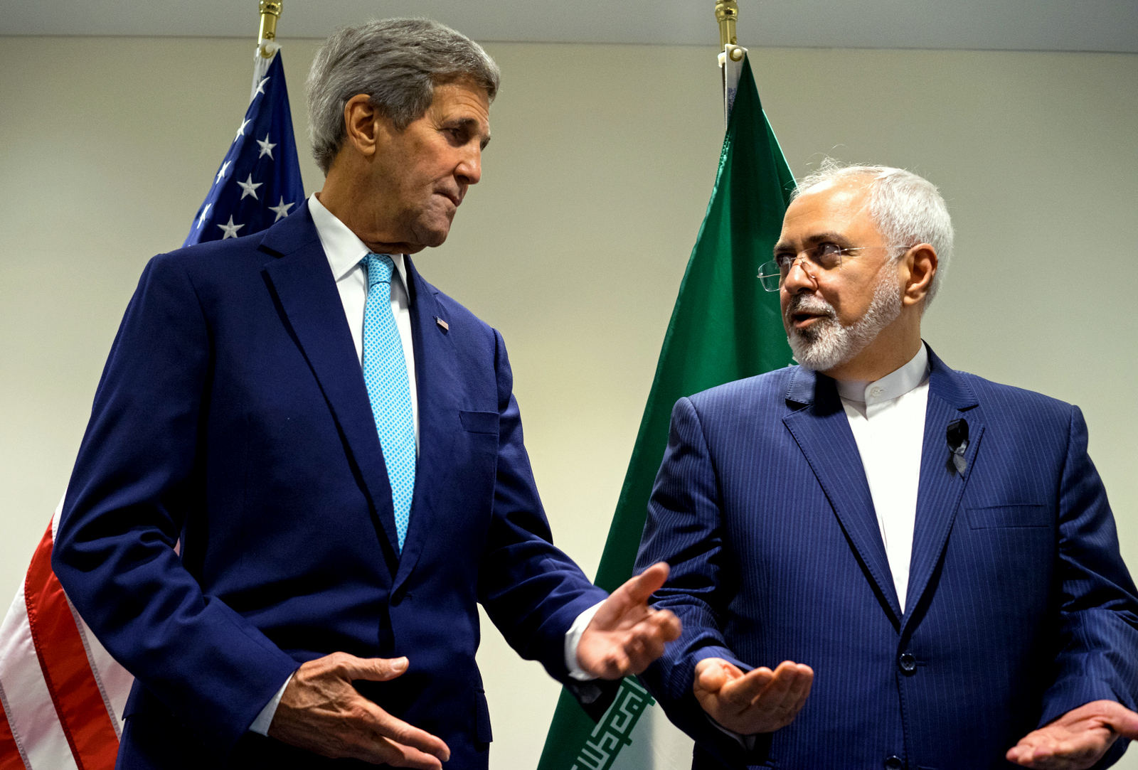 US Secretary of State John Kerry, left, meets with Iranian Foreign Minister Mohammad Javad Zarif at United Nations headquarters. Iran sits down with the United States, Russia, Europeans and key Arab states for the first time since the Syrian civil war began to discuss the future of the war-torn country. It will also break ground by bringing President Bashar Assad’s main supporter, Iran, to the same table as its regional rivals, including Turkey and Saudi Arabia, who have been backing many of the insurgent groups. (AP Photo/Craig Ruttle)