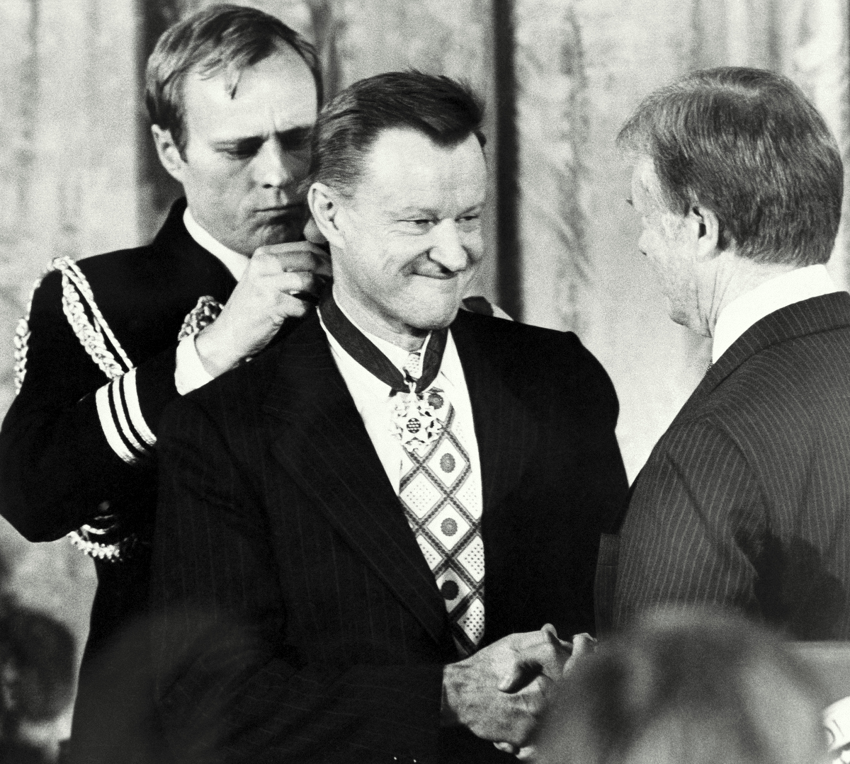 President Carter shakes hands with his national security adviser, Zbigniew Brzezinski, as he presents Brzezinski with the Medal of Freedom at a White House ceremony on Friday, Jan. 17, 1981 in Washington. Brzezinski was one of 15 recipients of the nation?s highest civilian awards, presented for service to U. S. security or national interests, world peace or cultural endeavors. (AP Photo)