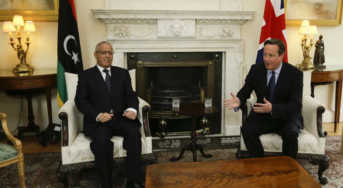 Britain's Prime Minister David Cameron, right, gestures as he speak to Libya's Prime Minister Ali Zeidan inside 10 Downing Street in London, Tuesday, Sept. 17, 2013. (AP Photo/Alastair Grant, Pool)