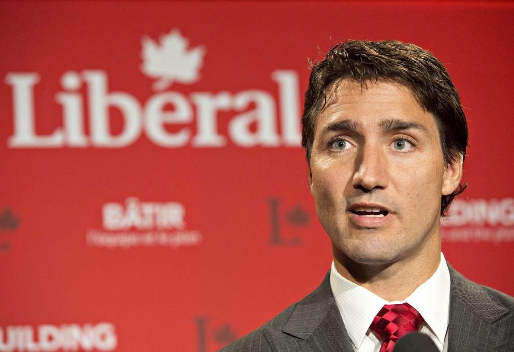 New Canadian PM Justin Trudeau gives his closing comments to media at the federal Liberal summer caucus meeting in Edmonton on Wednesday, Aug. 20, 2014. (AP Photo/The Canadian Press, Jason Franson)