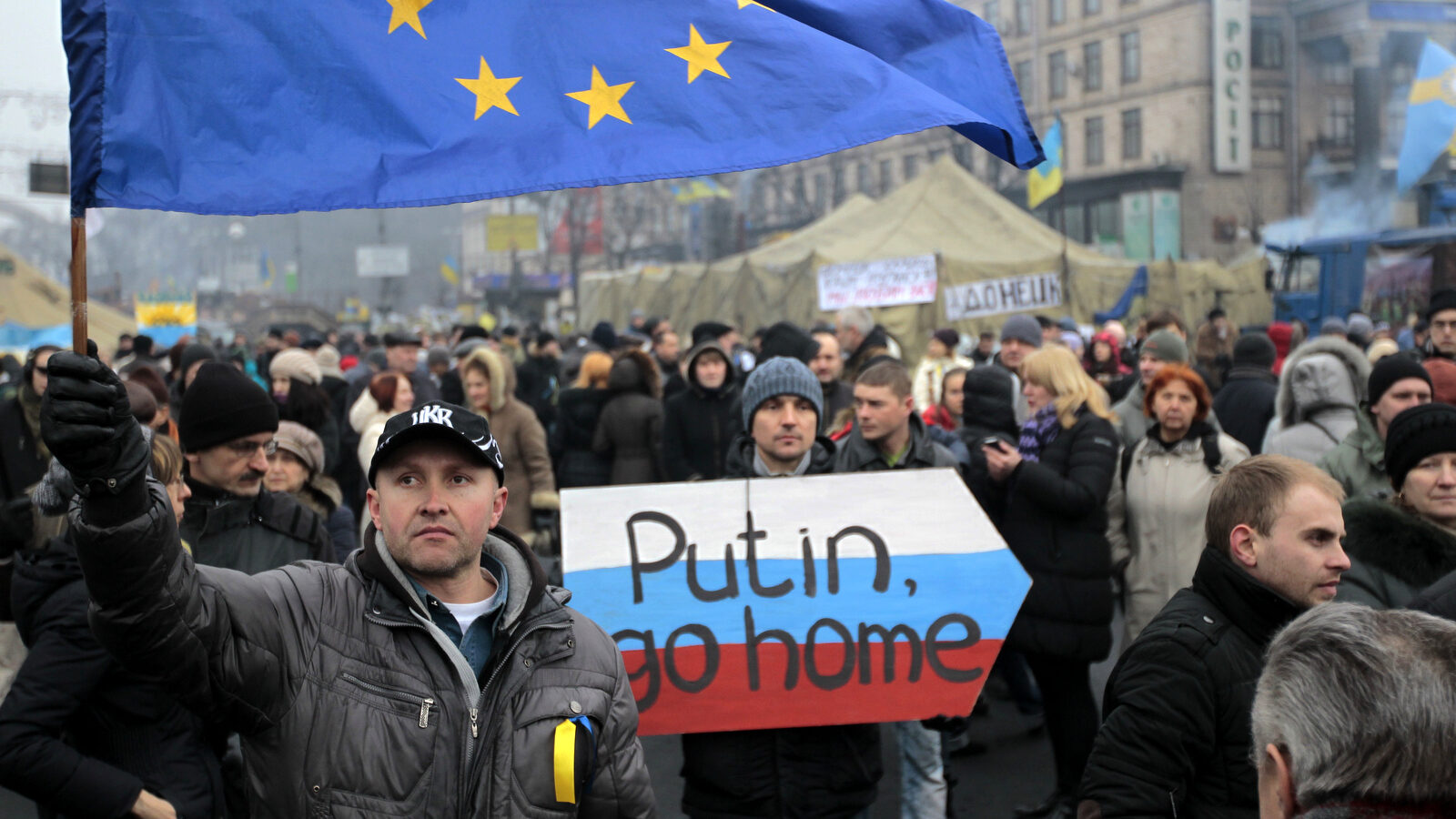 People gather during a rally in Kiev's Independence Square to protest Russia's involvment in Ukraine and Crimea. AP Photo/Sergei Chuzavkov)