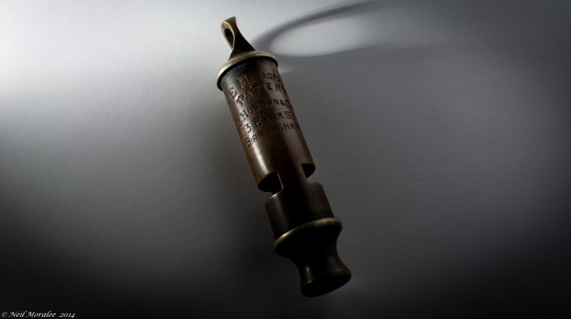 File: An antique metal whistle.