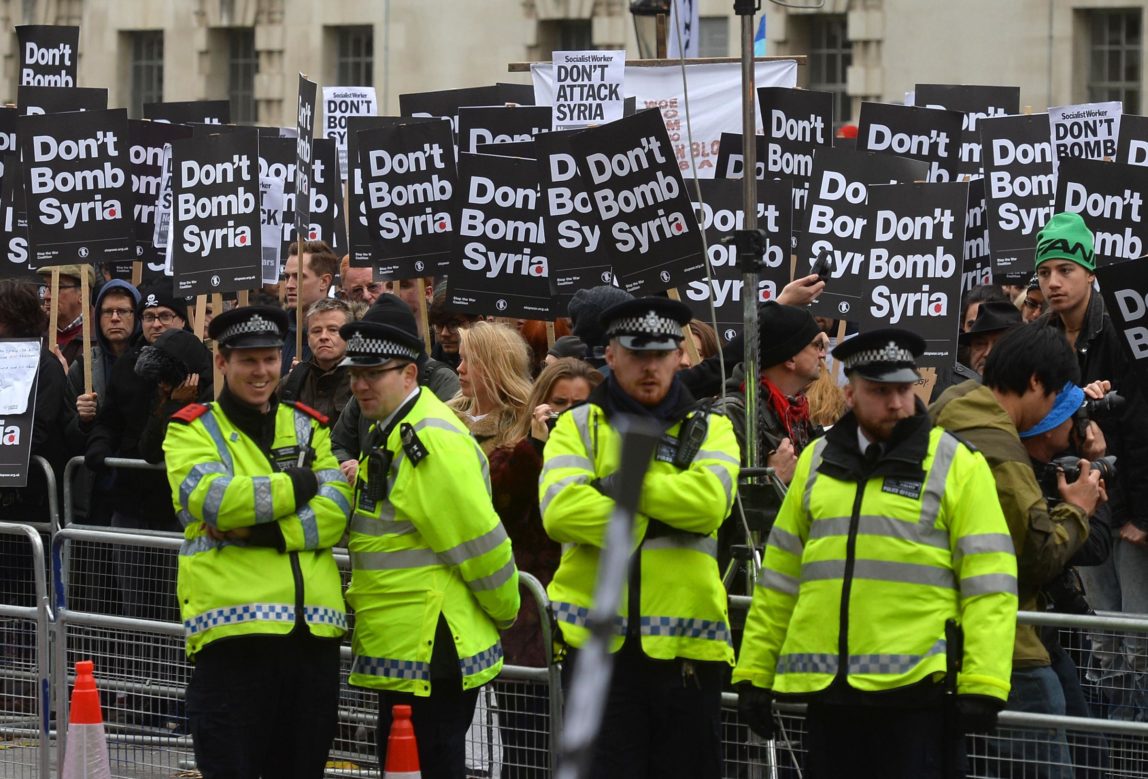 Demonstrators protest against British bombing of Syria outside Downing Street in London, Britain, 28 November 2015. (Hannah McKay/PA)