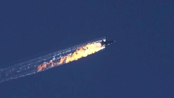 A still image made available on 24 November 2015 from video footage showing the Russian jet shortly before crashing to the ground.
