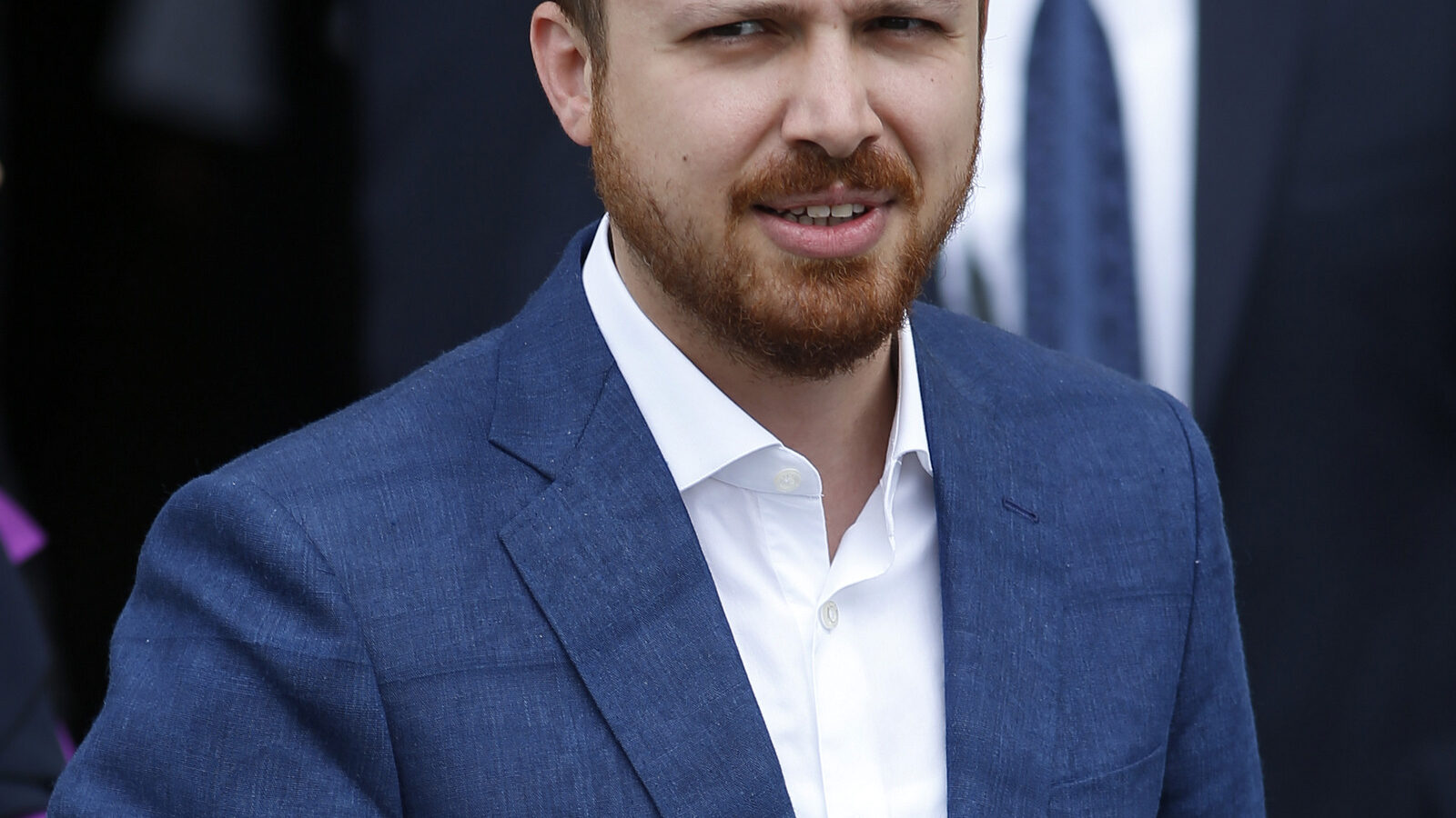 Bilal Erdogan, the son of Turkey's President Recep Tayyip Erdogan leaves a polling station after he voted, in Istanbul, Turkey, Sunday, June 7, 2015. Turks are heading to the polls in a crucial parliamentary election that will determine whether ruling party lawmakers can rewrite the constitution to bolster the powers of President Erdogan. All eyes will be on the results for the main Kurdish party, the Kurdish Peoples' Democratic Party, (HDP). If it crosses a 10 percent threshold for entering parliament as a party, that would extinguish AKP's constitutional plans. (AP Photo/Emrah Gurel)