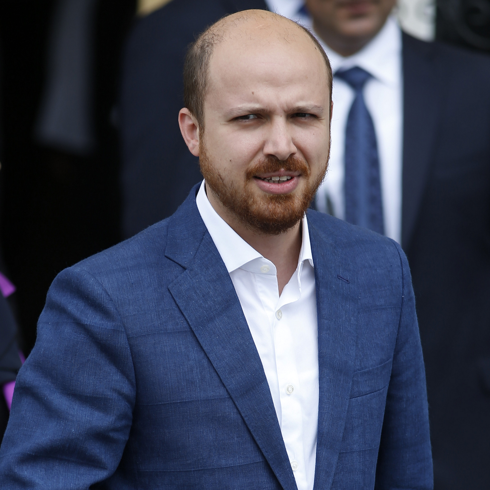 Bilal Erdogan, the son of Turkey's President Recep Tayyip Erdogan leaves a polling station after he voted, in Istanbul, Turkey, Sunday, June 7, 2015. Turks are heading to the polls in a crucial parliamentary election that will determine whether ruling party lawmakers can rewrite the constitution to bolster the powers of President Erdogan. All eyes will be on the results for the main Kurdish party, the Kurdish Peoples' Democratic Party, (HDP). If it crosses a 10 percent threshold for entering parliament as a party, that would extinguish AKP's constitutional plans. (AP Photo/Emrah Gurel)