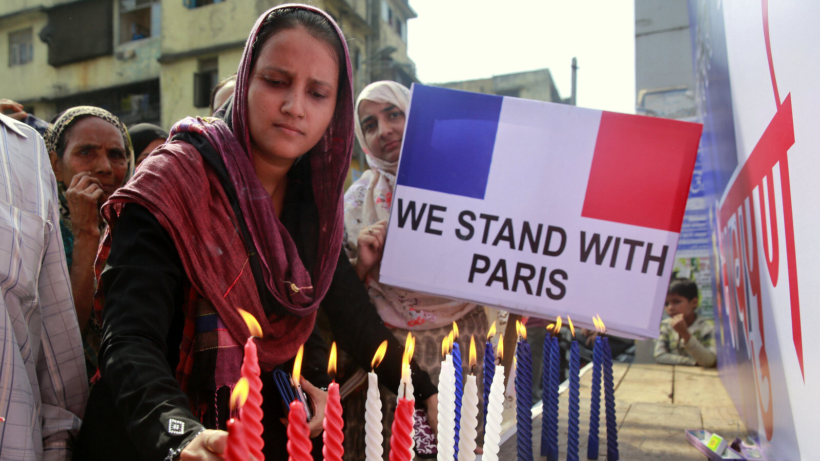 Indian Muslim women expressing solidarity with France following Friday’s attacks in Paris light candles in Mumbai, India, Monday, Nov.16, 2015. (AP Photo/Rafiq Maqbool)