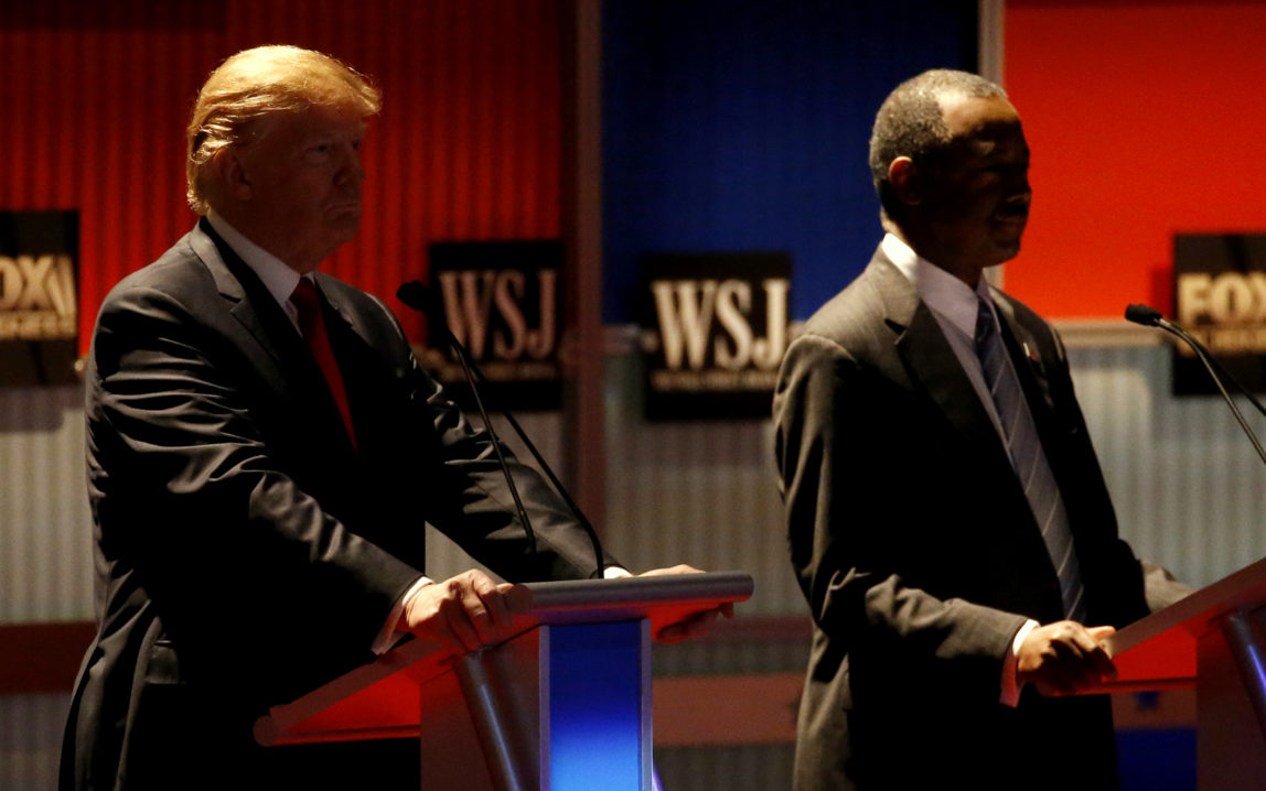 Donald Trump and Ben Carson watt before a Republican presidential debate at Milwaukee Theatre, Tuesday, Nov. 10, 2015, in Milwaukee. (AP Photo/Morry Gash)