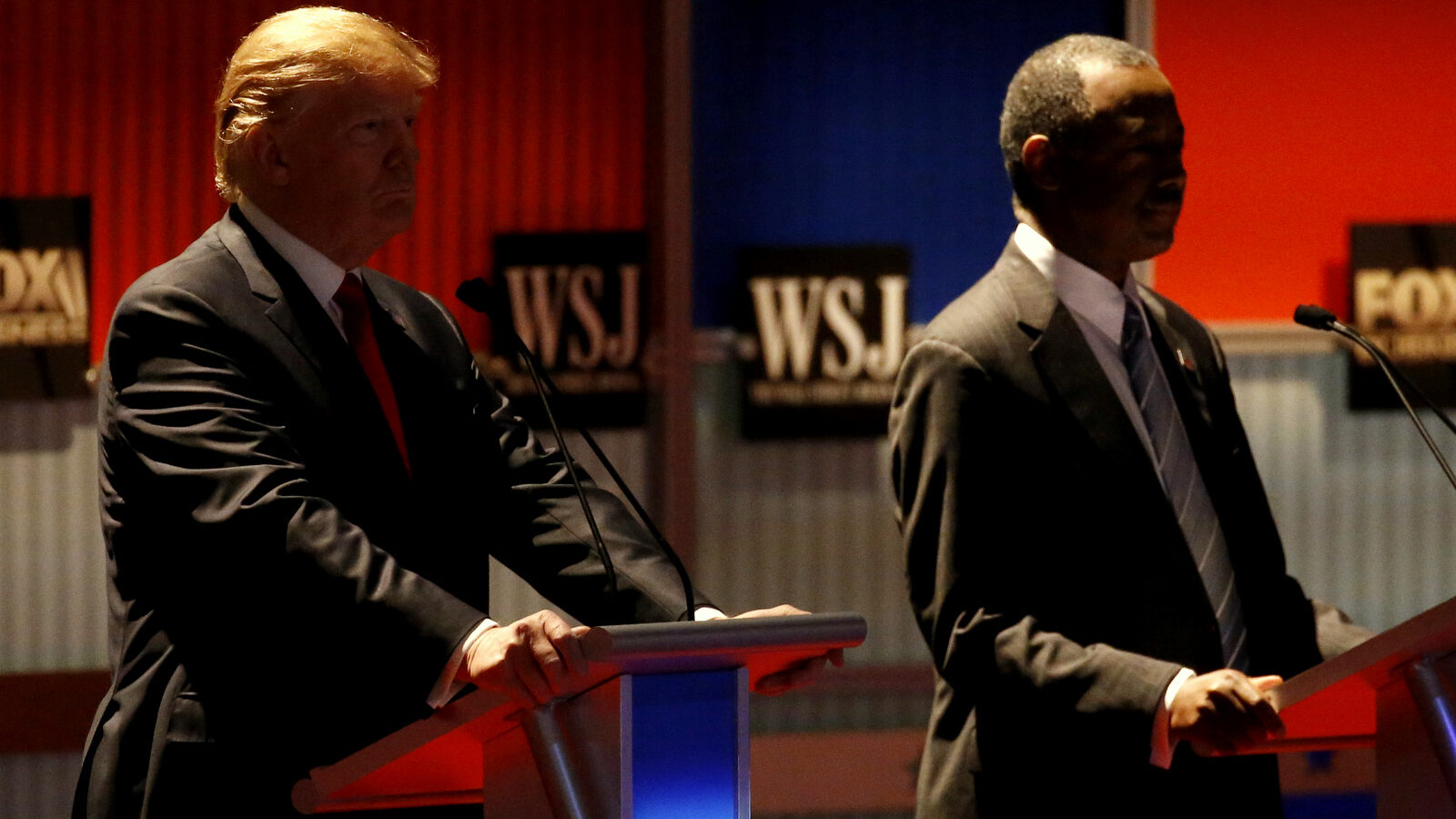 Donald Trump and Ben Carson watt before a Republican presidential debate at Milwaukee Theatre, Tuesday, Nov. 10, 2015, in Milwaukee. (AP Photo/Morry Gash)