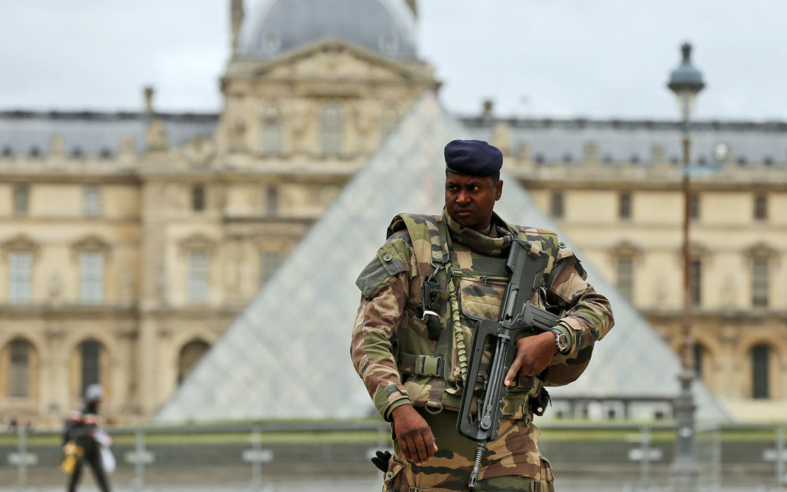 A soldier patrols in the courtyard of the Louvre Museum in Paris, Tuesday, Nov. 17, 2015. France made an unprecedented demand on Tuesday for its European Union allies to support its military action against the Islamic State group as it launched new airstrikes on the militants' Syrian stronghold. (AP Photo/Frank Augstein)