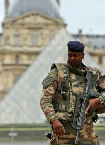 A soldier patrols in the courtyard of the Louvre Museum in Paris, Tuesday, Nov. 17, 2015. France made an unprecedented demand on Tuesday for its European Union allies to support its military action against the Islamic State group as it launched new airstrikes on the militants' Syrian stronghold. (AP Photo/Frank Augstein)