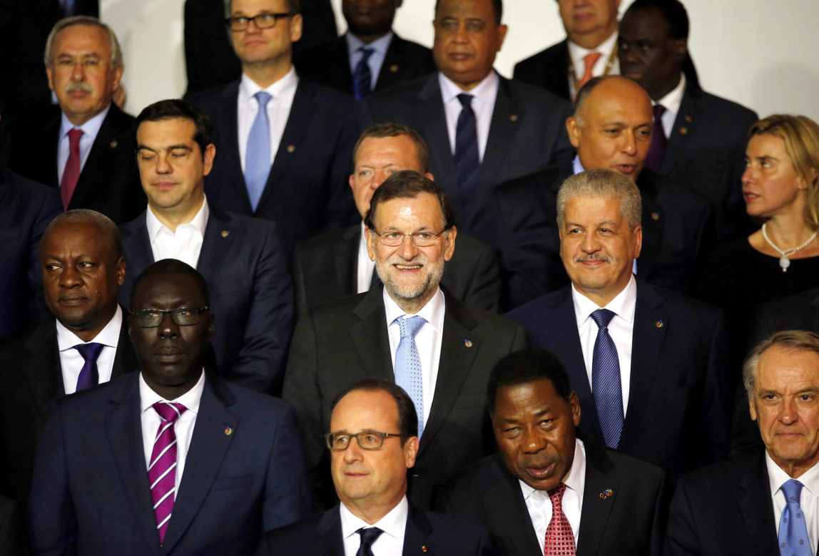 Spain's Prime Minister Mariano Rajoy, center, smiles as he poses for a family picture with European Union and African leaders on the occasion of an informal summit on migration in Valletta, Malta, Wednesday, Nov. 11, 2015. (AP Photo/Antonio Calanni)