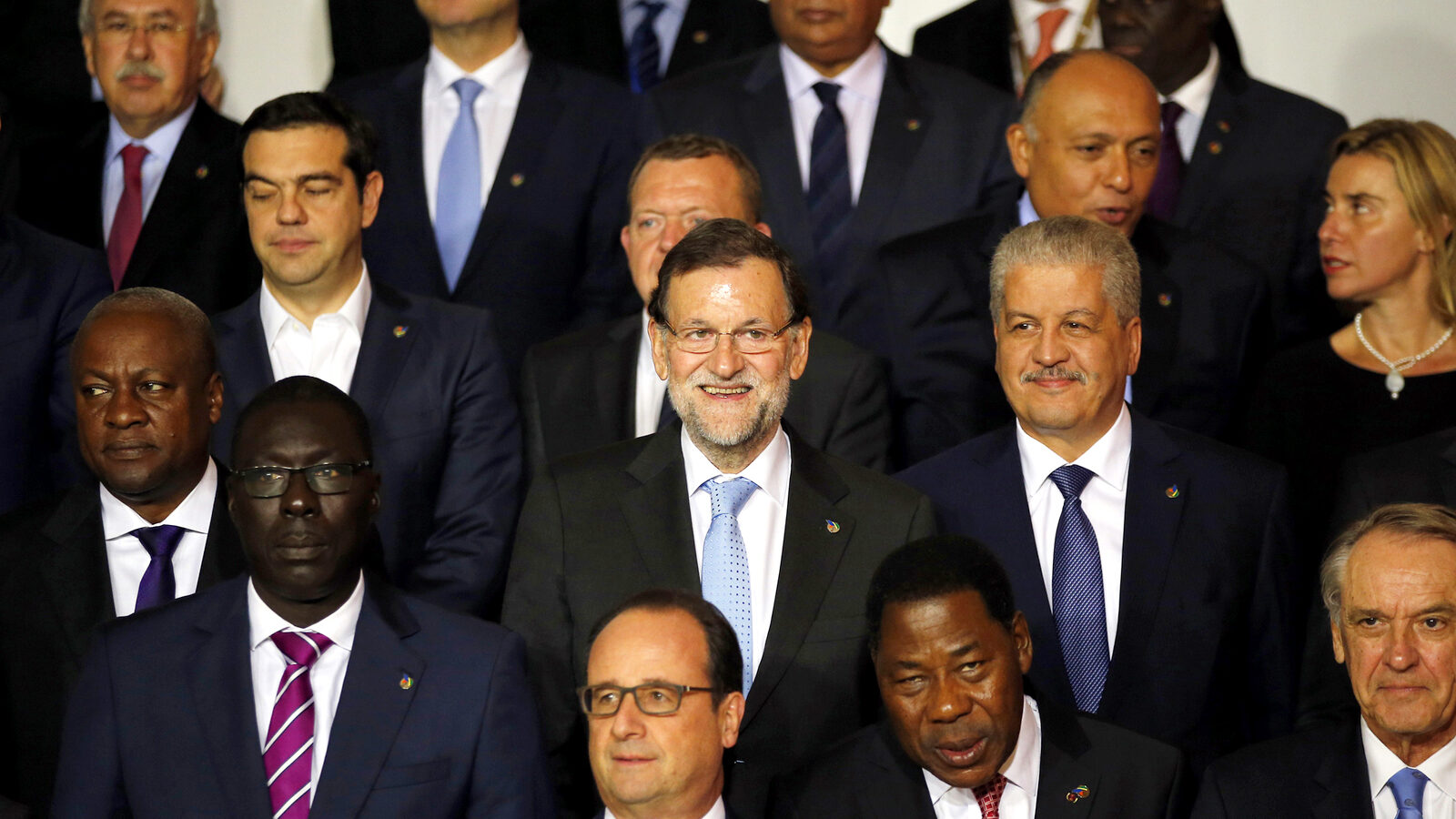 Spain's Prime Minister Mariano Rajoy, center, smiles as he poses for a family picture with European Union and African leaders on the occasion of an informal summit on migration in Valletta, Malta, Wednesday, Nov. 11, 2015. (AP Photo/Antonio Calanni)