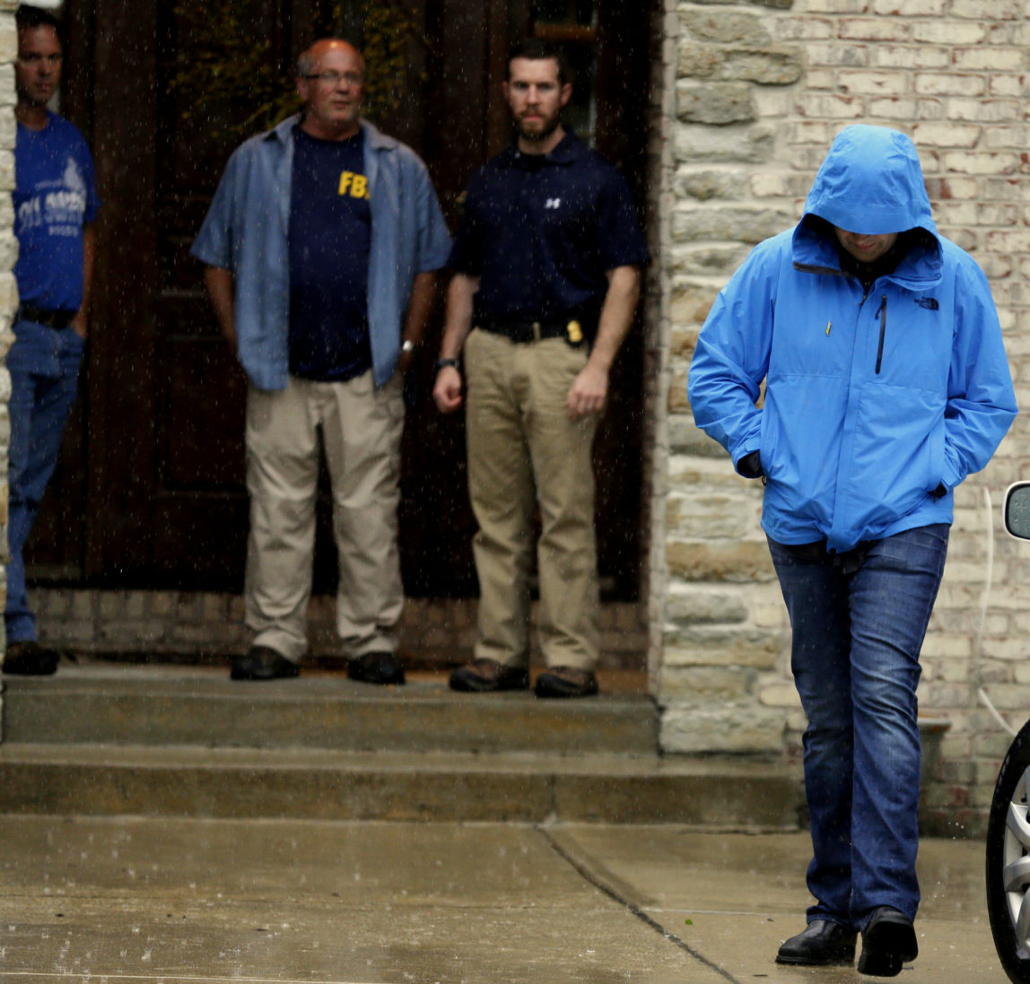 Subway restaurant spokesman Jared Fogle walks to a waiting car as he leaves his home, in Zionsville, Ind. A raid at Fogle's home on Tuesday is just the latest bad news to hit the ubiquitous sandwich chain. The company has been struggling with sales, its CEO is being treated for cancer and it’s trying to convince customers about the quality and value of its food. (AP Photo/Michael Conroy)