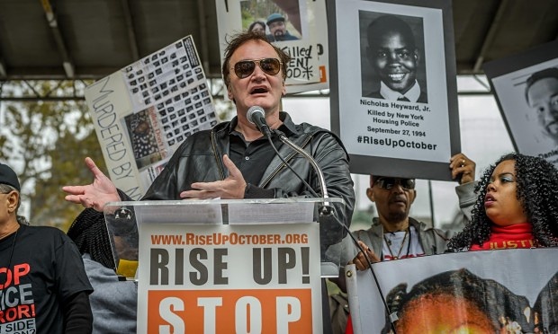 Not backing down ... Quentin Tarantino speaks at a New York anti-police brutality protest on 24 October. Photograph: guardian.co.uk