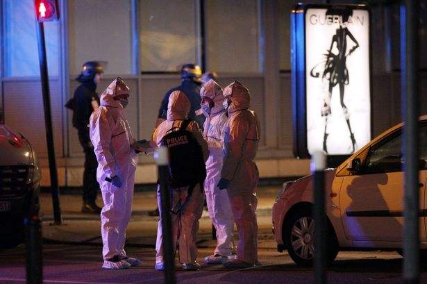 Forensic experts outside the Stade de France stadium in Saint-Denis 