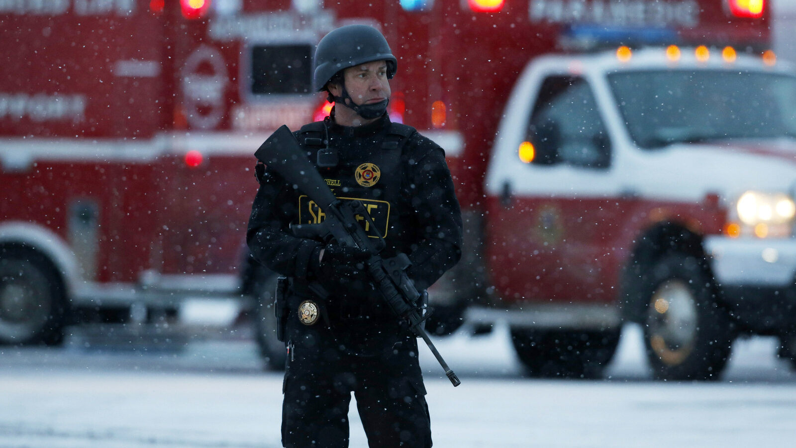 An officer stands guard near a Planned Parenthood clinic Friday, Nov. 27, 2015, in Colorado Springs, Colo. A gunman opened fire at the clinic on Friday, authorities said, wounding multiple people. (AP Photo/David Zalubowski)