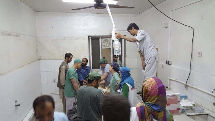 Afghan surgeons work inside a Medecins Sans Frontieres (MSF) hospital after an air strike in the city of Kunduz, Afghanistan, on Saturday. Photo: Medecins Sans Frontieres