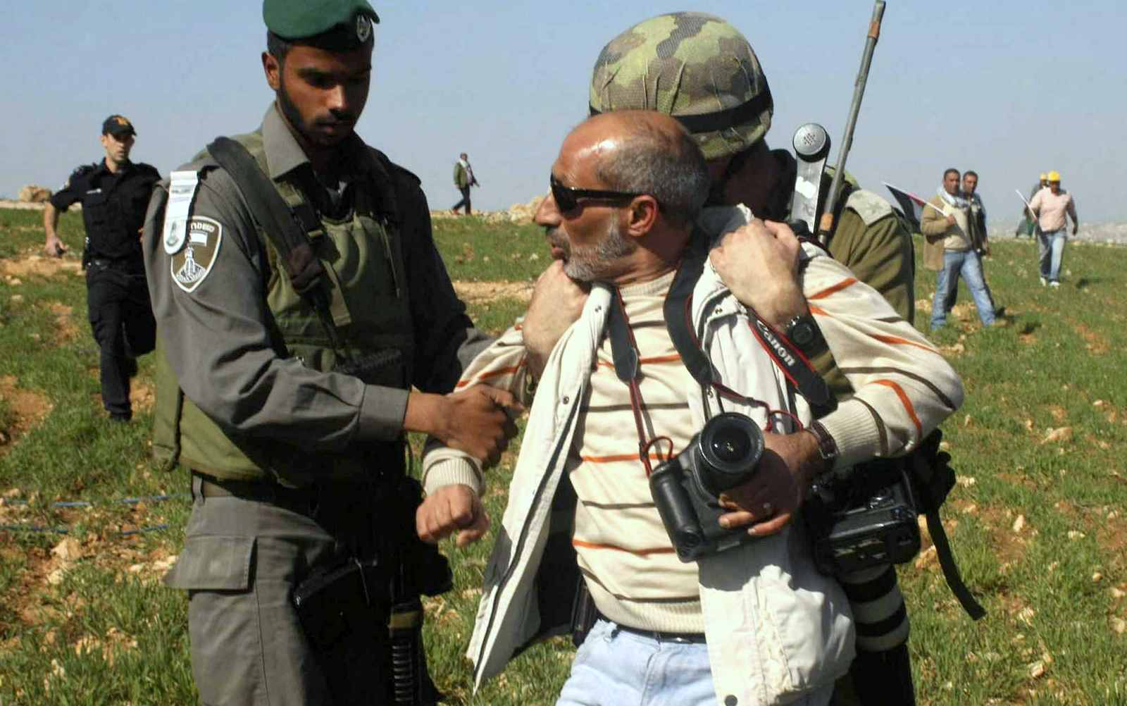 Israeli security detain The Associated Press photographer Nasser Shiyoukhi during a Palestinian protest in Yatta in the West Bank on Saturday. Shiyoukhi was released without charge after Saturday’s incident. (photo credit: AP Photo)