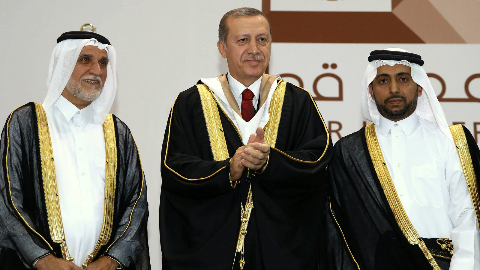 Turkey's President Recep Tayyip Erdogan applauds after he received an honorary doctorate from Qatar University in Doha, Qatar, Dec. 2, 2015. Turkey and Qatar are two of the main benefactors of the Syrian rebels. (AP Photo)
