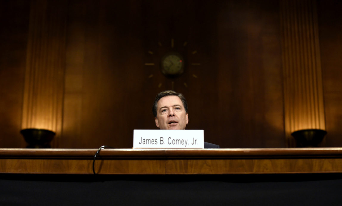 FBI Director James Comey testifies on Capitol Hill in Washington, Wednesday, Dec. 9, 2015, before the Senate Judiciary Committee. Comey said the two San Bernardino shooters were radicalized at least two years ago and had discussed jihad and martyrdom as early as 2013. (AP Photo/Susan Walsh)