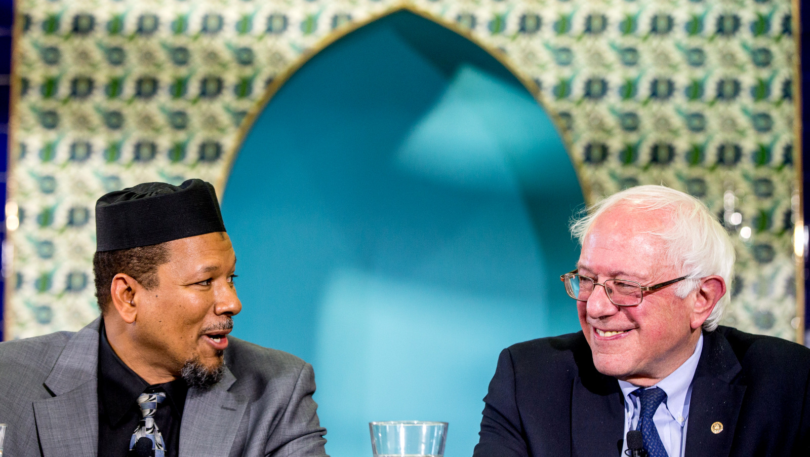 Democratic presidential candidate Sen. Bernie Sanders, I-Vt. listens as Imam Talib Shareef speaks during an interfaith roundtable hosted by at Masjid Muhammad, the Nation's Mosque in Washington, Wednesday, Dec. 16, 2015, for a discussion on standing up to anti-Muslim rhetoric. (AP Photo/Andrew Harnik)