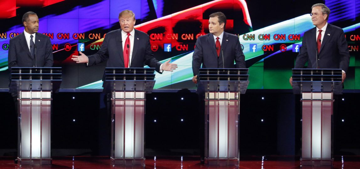 Donald Trump, second from left, makes a point as Ben Carson, left, Ted Cruz, second from right, and Jeb Bush look on during the CNN Republican presidential debate at the Venetian Hotel & Casino on Tuesday, Dec. 15, 2015, in Las Vegas. (AP Photo/John Locher)
