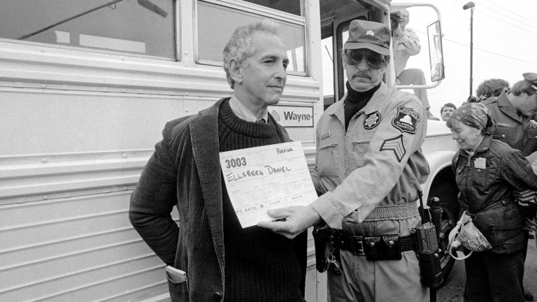 Daniel Ellsberg, whistle-blower and former presidential adviser on nuclear strategy, is shown being photographed and placed in a bus after his arrest on Monday, June 22, 1982 at the Lawrence Livermore Laboratory in Livermore, California. Ellsberg was demonstrators opposed to Nuclear weapons development at Lawrence Livermore Lab were hauled off to jail as well as Ellsberg. (AP Photo)