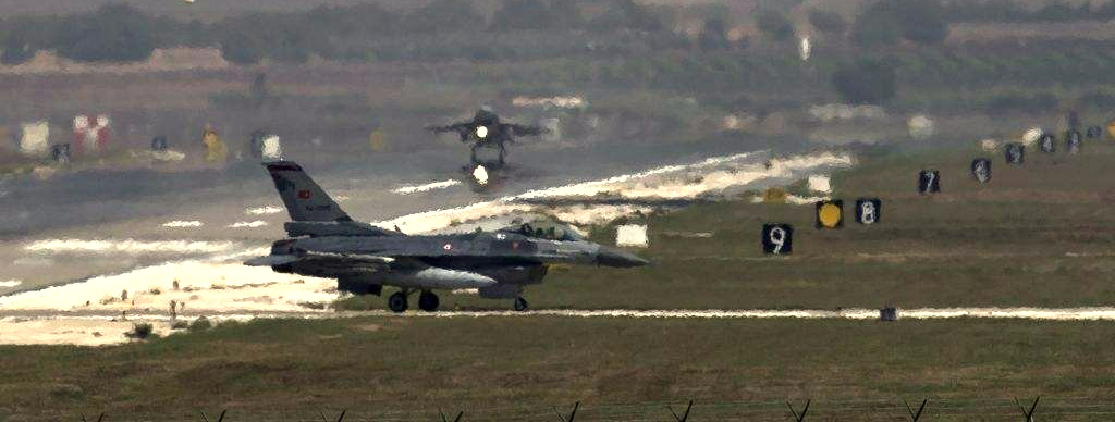 A US Air Force plane takes off as a Turkish Air Force fighter jet taxis at the Incirlik airbase, southern Turkey, Sunday, Sept. 1, 2013. (Photo: AP/Vadim Ghirda)