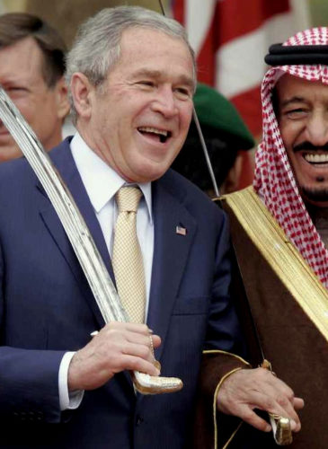 King Salman, the current ruler of Saudi Arabia, poses with former U.S. president George W. Bush. (AP Photo)
