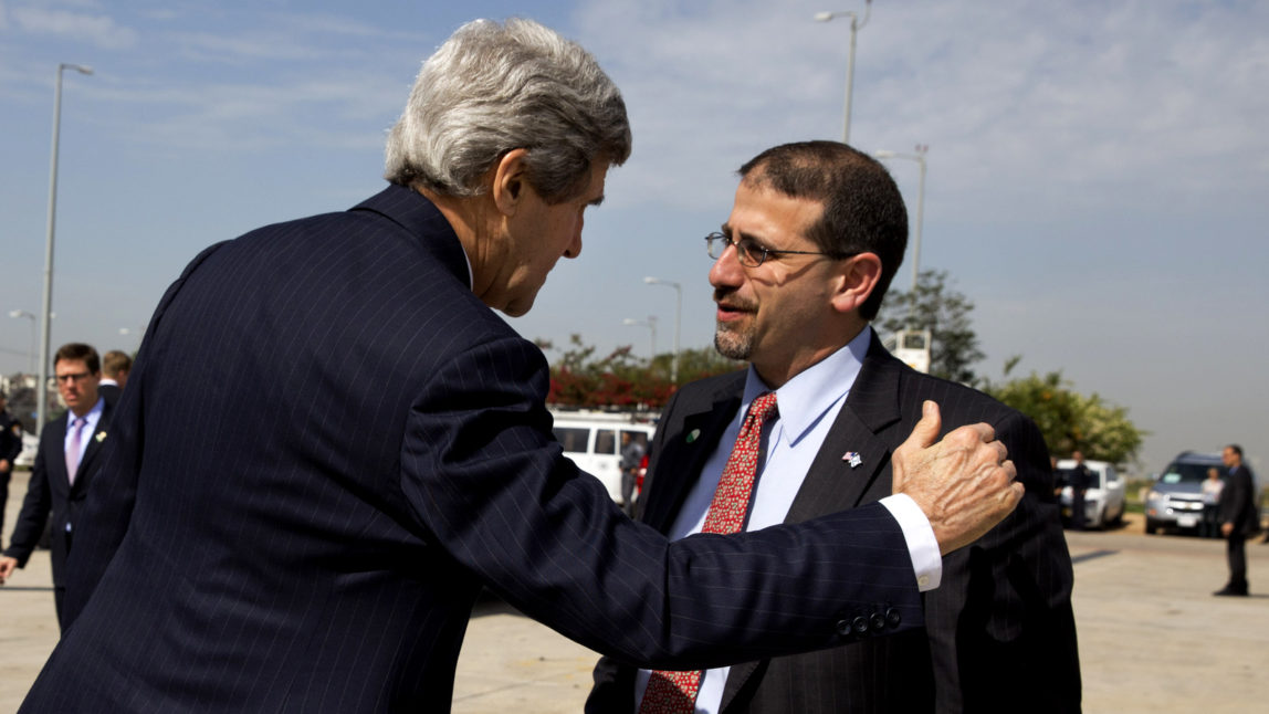 U.S. Secretary of State John Kerry confers with U.S. Ambassador to Israel Daniel Shapiro, right, in Tel Aviv, Israel Tuesday April 1, 2014, (AP Photo/Jacquelyn Martin)