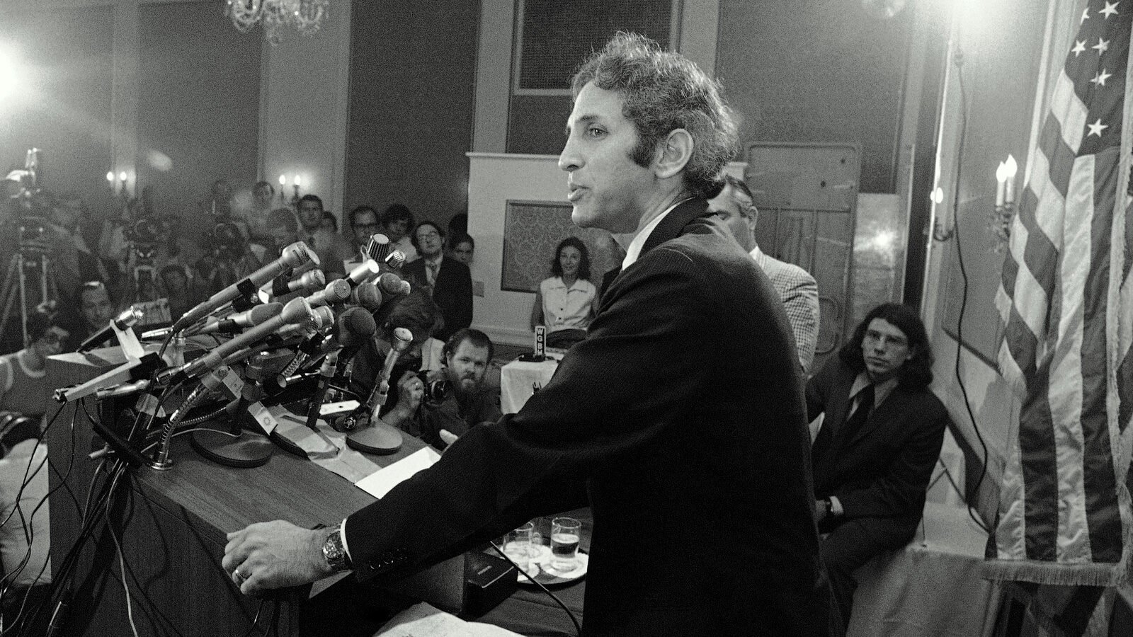 Dr. Daniel Ellsberg faces a battery of microphones at a news conference in Cambridge on Thursday, July 1, 1971. Ellsberg charged that government secrecy has led to the deaths of 50,000 Americans in Vietnam. (AP Photo)