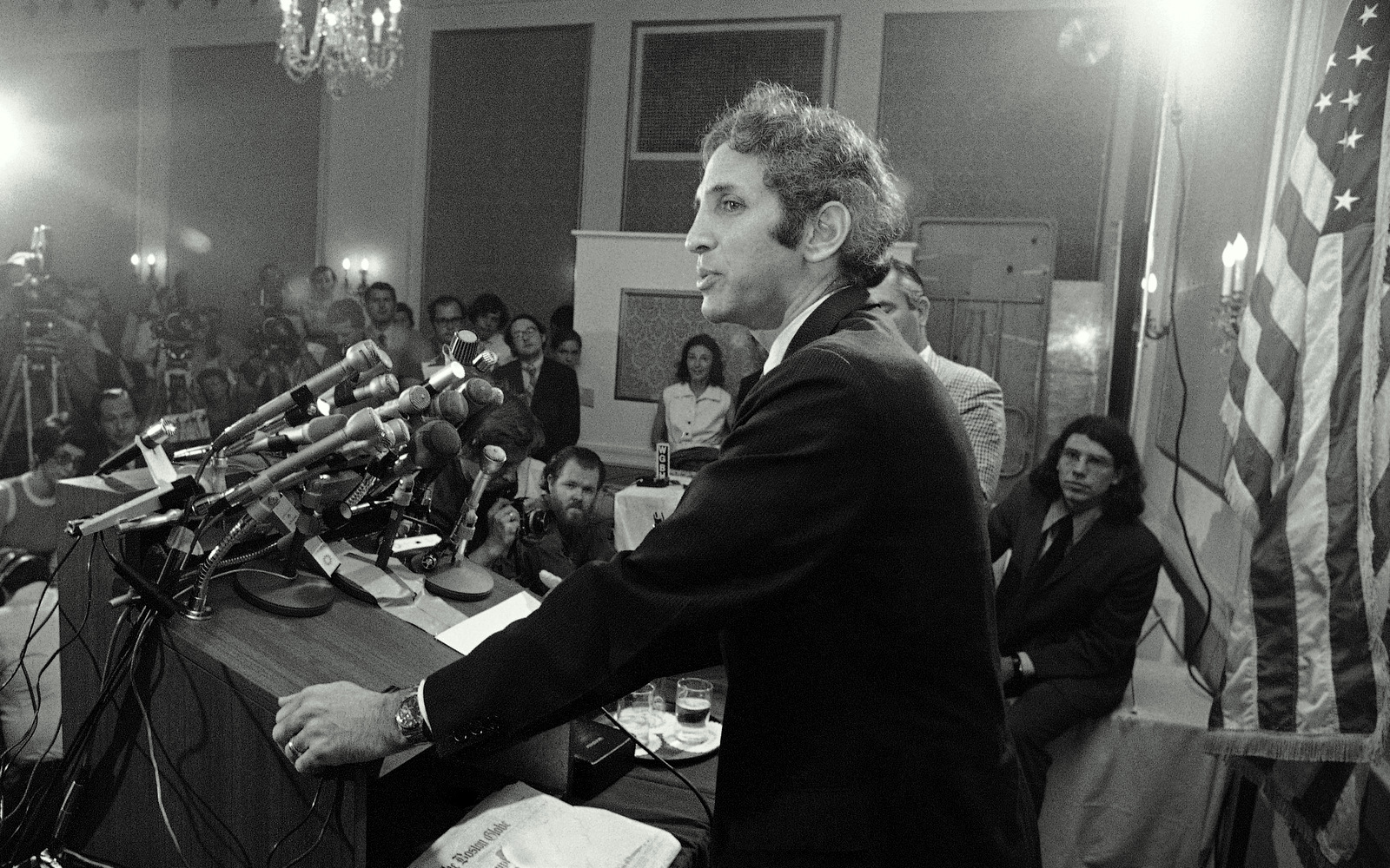 Dr. Daniel Ellsberg faces a battery of microphones at a news conference in Cambridge on Thursday, July 1, 1971. Ellsberg charged that government secrecy has led to the deaths of 50,000 Americans in Vietnam. (AP Photo)