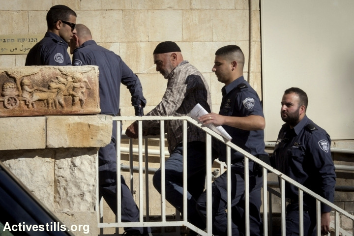 Activist Ezra Nawi arrives to Ha-Shalom court in Jerusalem, after he was arrested a day before in the airport, January 12, 2015. Nawi, a veteran activist in south Hebron hills, was arrested following a report on channel two, in which he was recorded saying that he informs the Palestinian police about Palestinians that sell their land to settlers, and that the police executes them. Despite what he said, no Palestinian was executed by the Palestinian authority since 2005. Since his arrest he was prevented from meeting his lawyer. 