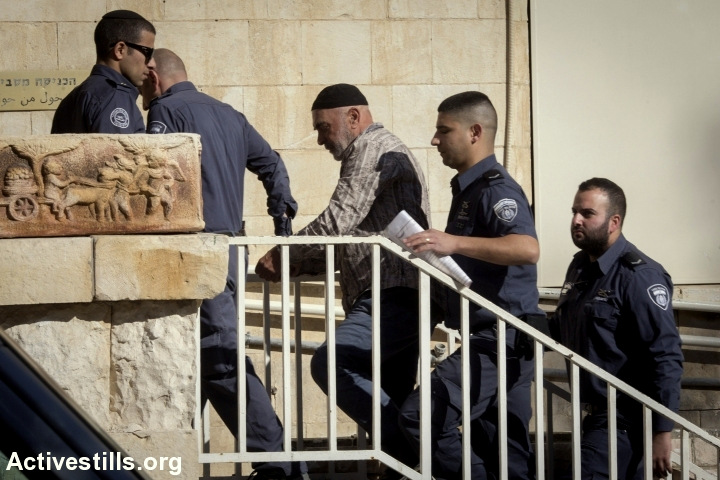 Activist Ezra Nawi arrives to Ha-Shalom court in Jerusalem, after he was arrested a day before in the airport, January 12, 2015. Nawi, a veteran activist in south Hebron hills, was arrested following a report on channel two, in which he was recorded saying that he informs the Palestinian police about Palestinians that sell their land to settlers, and that the police executes them. Despite what he said, no Palestinian was executed by the Palestinian authority since 2005. Since his arrest he was prevented from meeting his lawyer.