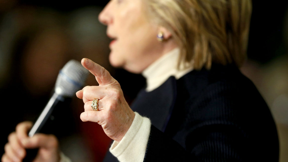 Democratic presidential candidate Hillary Clinton gestures as she speaks at a town hall at the Toledo Civic Center in Toledo, Iowa, Monday, Jan. 18, 2016. (AP Photo/Patrick Semansky)