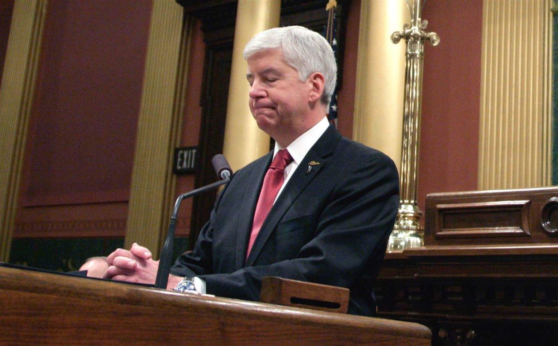 Michigan Gov. Rick Snyder, left, pauses as he delivers his State of the State address to a joint session of the House and Senate, Tuesday, Jan. 19, 2016, at the state Capitol in Lansing, Mich. (Photo: Al Goldis/AP)