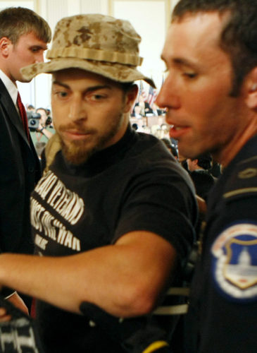 Former Marine Adam Kokesh is detained by Capitol Hill Police on Capitol Hill in Washington, Monday, Sept. 10, 2007, as Gen. David Petraeus and U.S. Ambassador to Iraq Ryan Crocker testified before the House Armed Services Committee hearing on the future course of the war in Iraq. (AP Photo/Gerald Herbert)
