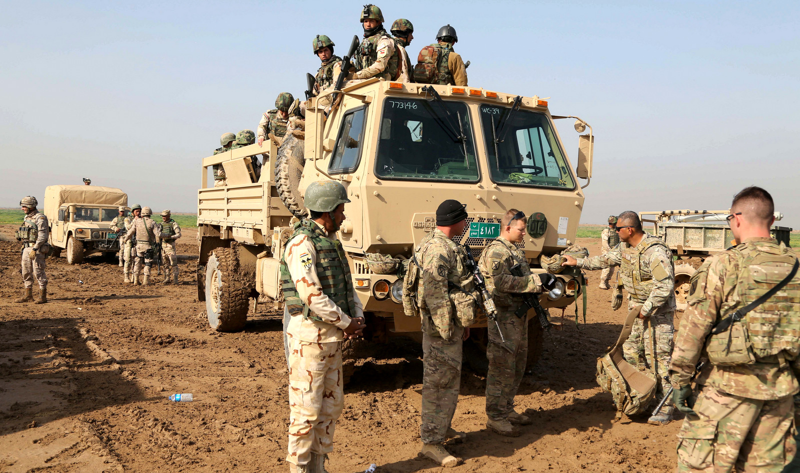 In this Sunday, Jan. 24, 2016 file photo, American soldiers participate in a training exercise at Basmaya base, 40 kilometers southeast of Baghdad, Iraq. (AP Photo/Karim Kadim)