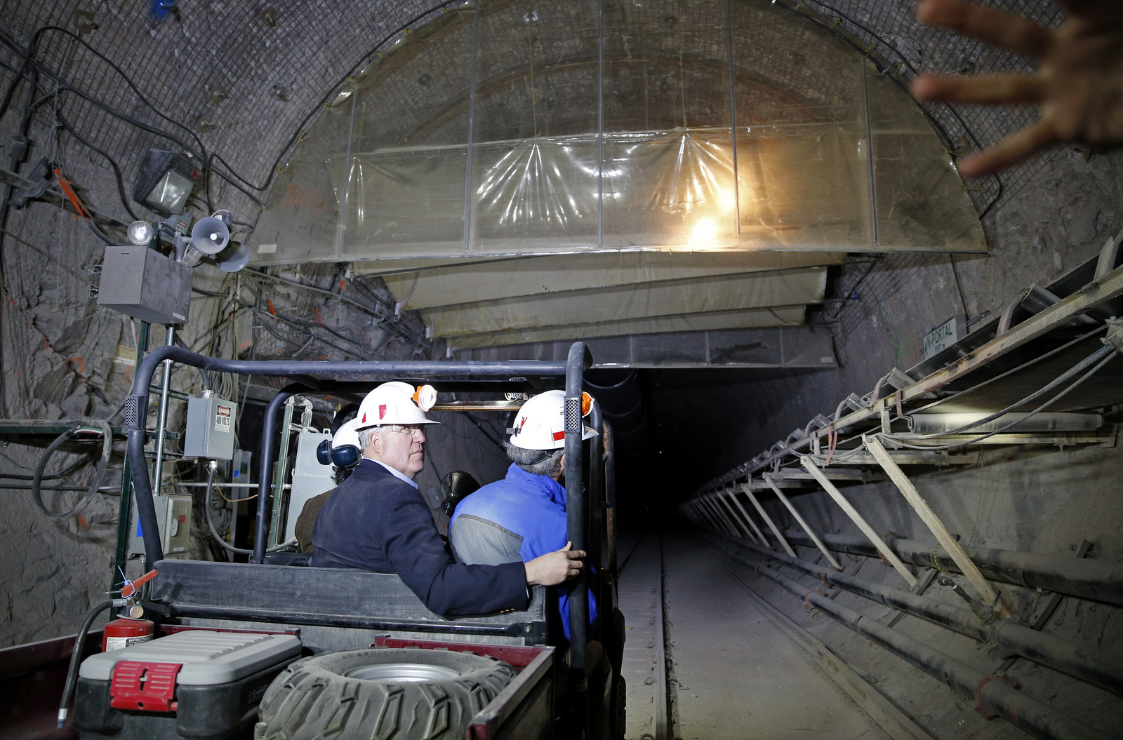 Rep. John Shimkus, R-Ill., left, looks around inside of Yucca Mountain during a congressional tour Thursday, April 9, 2015, near Mercury, Nev. Several members of congress toured the proposed radioactive wast dump 90 miles northwest of Las Vegas. (AP Photo/John Locher)