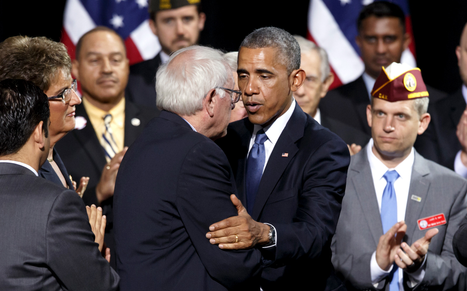 President Barack Obama embraces Senate Veterans’ Affairs Chairman Sen. Bernie Sanders, I-Vt., as he visits Fort Belvoir, Va., an Army base 20 miles south of Washington. (AP Photo/J. Scott Applewhite)