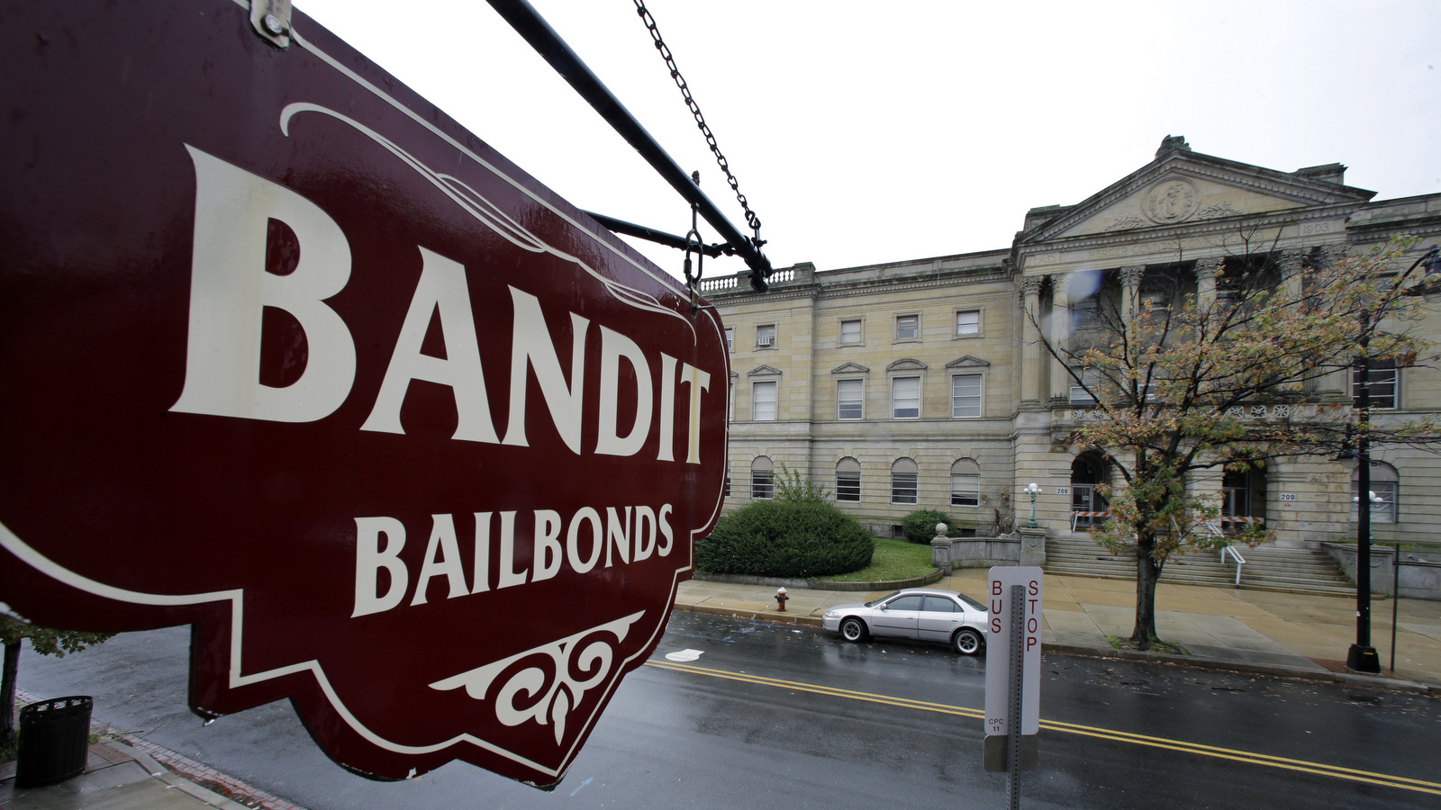 A sign is seen outside a bail bondsman across the street from Mercer County criminal courthouse Thursday, Oct. 23, 2014, in Trenton, N.J. There isn’t much disagreement with the underlying goal of a constitutional amendment that will be before New Jersey voters next month: Low-level suspects who are not threats to anyone should not have to pay to get out of jail as they await trial, and those who are threats shouldn’t be let out on bail at all. But there is some debate over whether the ballot measure would accomplish that. (AP Photo/Mel Evans)